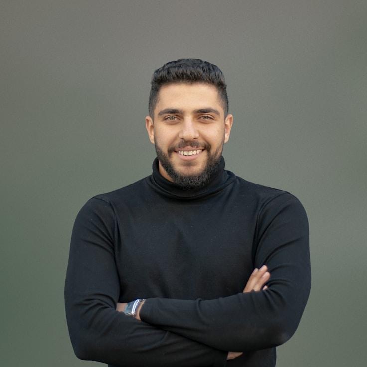 Kaveri Mehta, Lead Design Curator at Golden River Junction, reviewing corporate floral arrangements